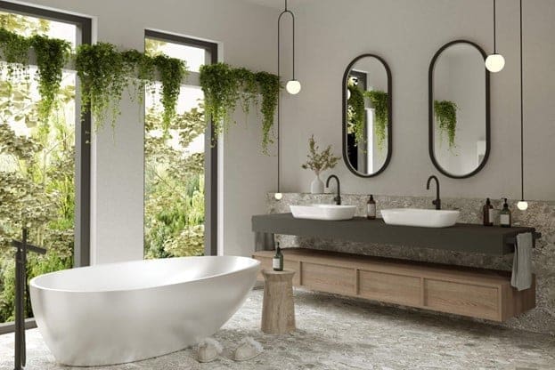 Modern bathroom with freestanding tub, double vanity, mirrors, and hanging greenery at Austin, TX