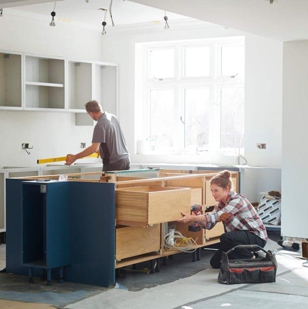 Kitchen renovation in progress with cabinet installation in a home in Austin, TX
