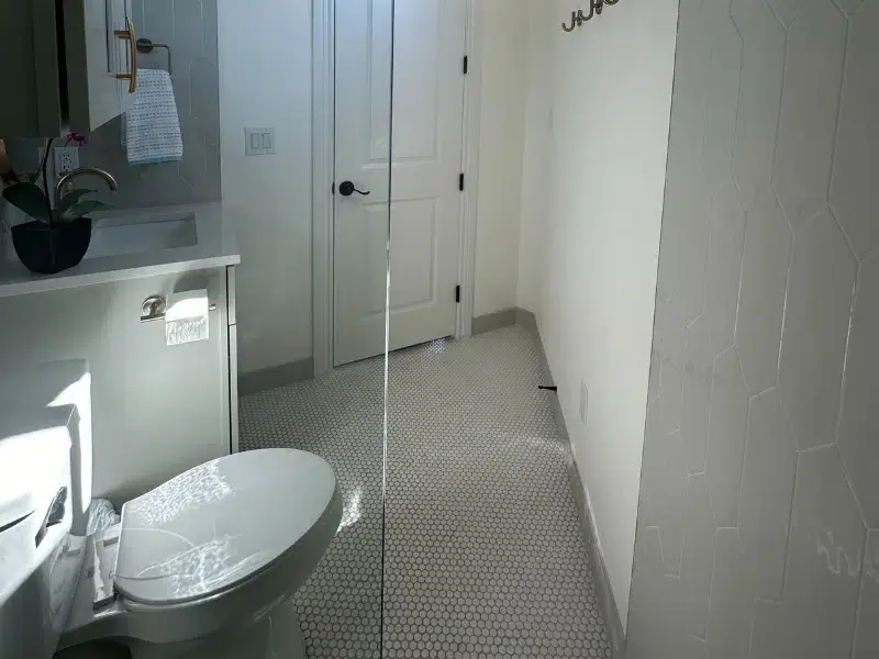 El Cielo Whole Home Remodel featuring a stylish vanity and modern flooring in Austin, TX