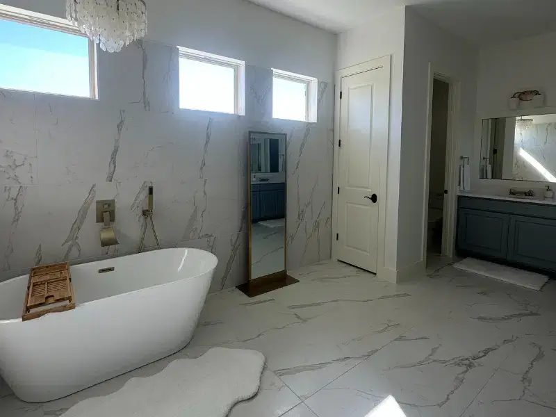 Luxury bathroom with freestanding tub and marble tile in an Austin, TX<br />
